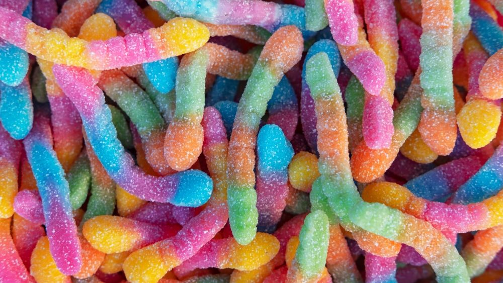 Several handfuls of neon-colored chewable crawlers.