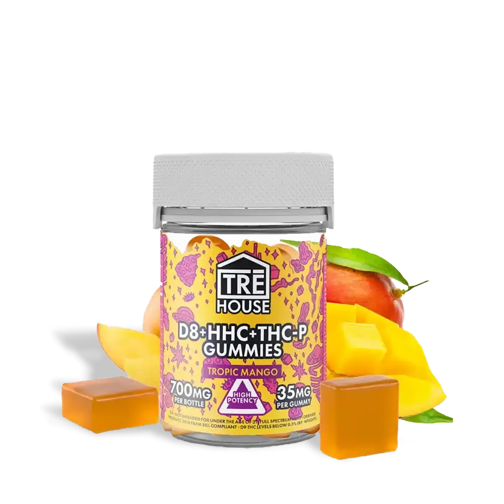 Trē house tropic mango gummies by thcgummies. Com. Featured photo of the bottle and the gummies with a full size mango and sliced mango chunks in the background.