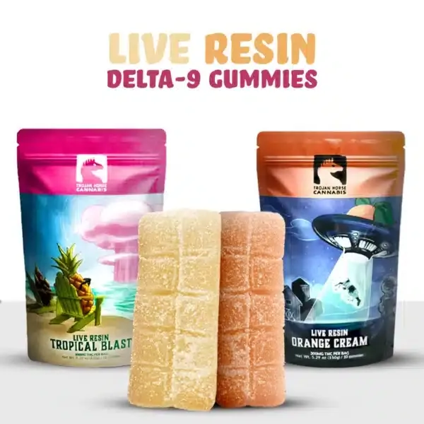 Two opened packs of trojan horse cannabis live resin gummies showcasing tropical blast and orange cream live gummies with their radiant translucent colors on display while casting shadows on a white background.