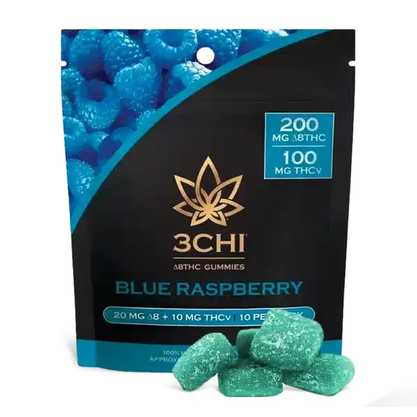 The product packaging of a 3chi blue raspberry thcv gummies 10-pack with several life-size examples of the blue and teal gummies on display in front of the package.